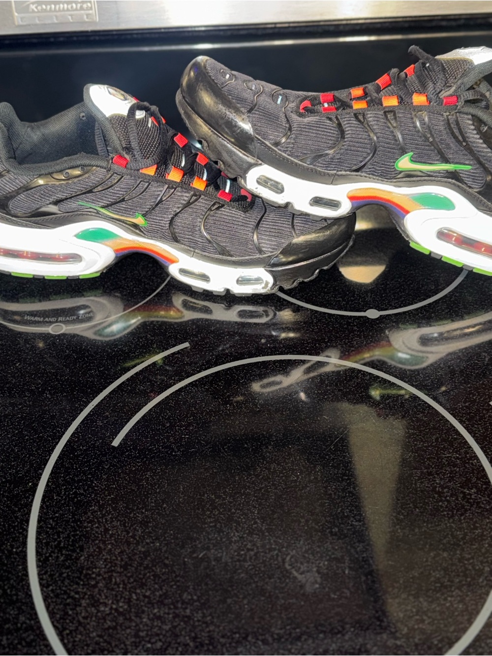Nike Black Sneakers with Rainbow Swoosh and Red Lace Accents